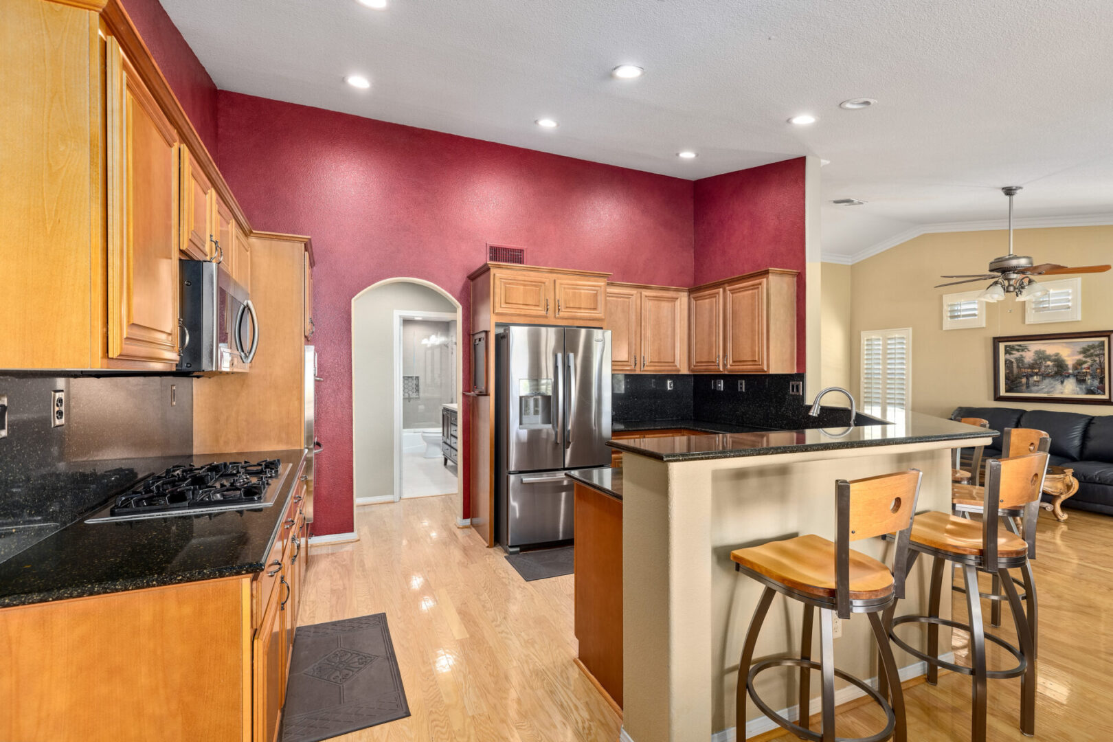 dining area and kitchen with red walls