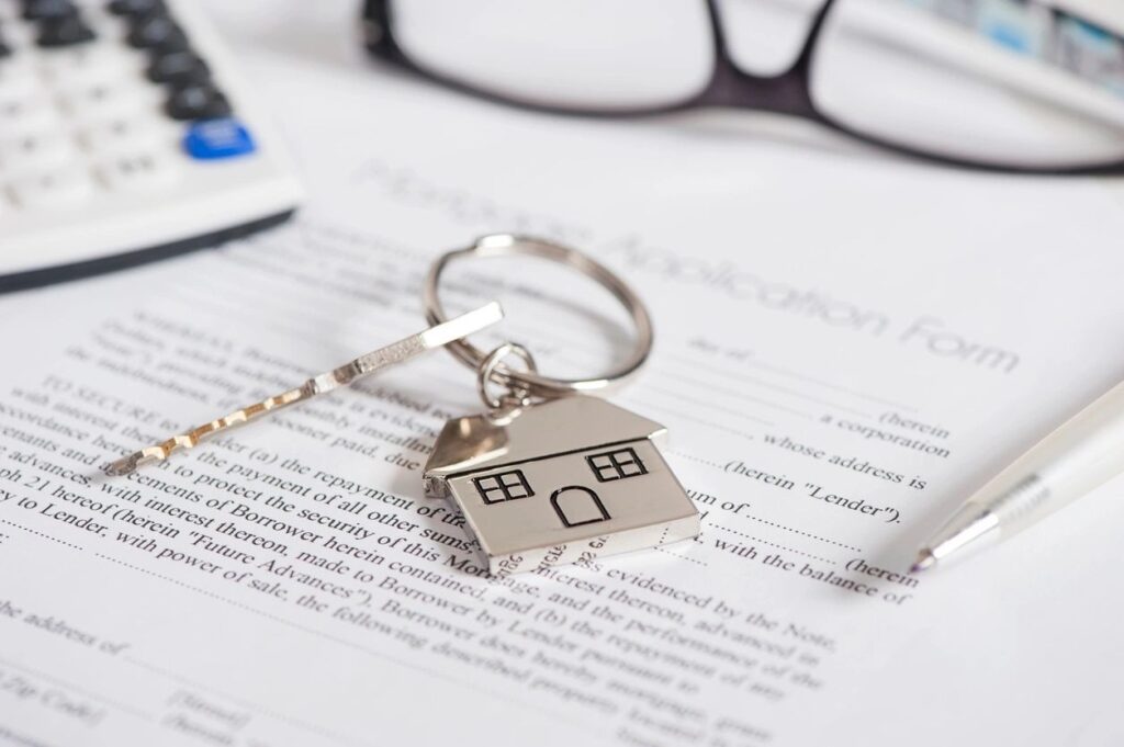 A House Shape Keychain on a Document Paper
